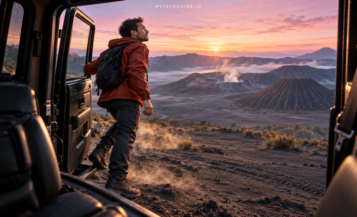 Traveler stepping out of a jeep overlooking Mount Bromo at sunrise in East Java, Indonesia.